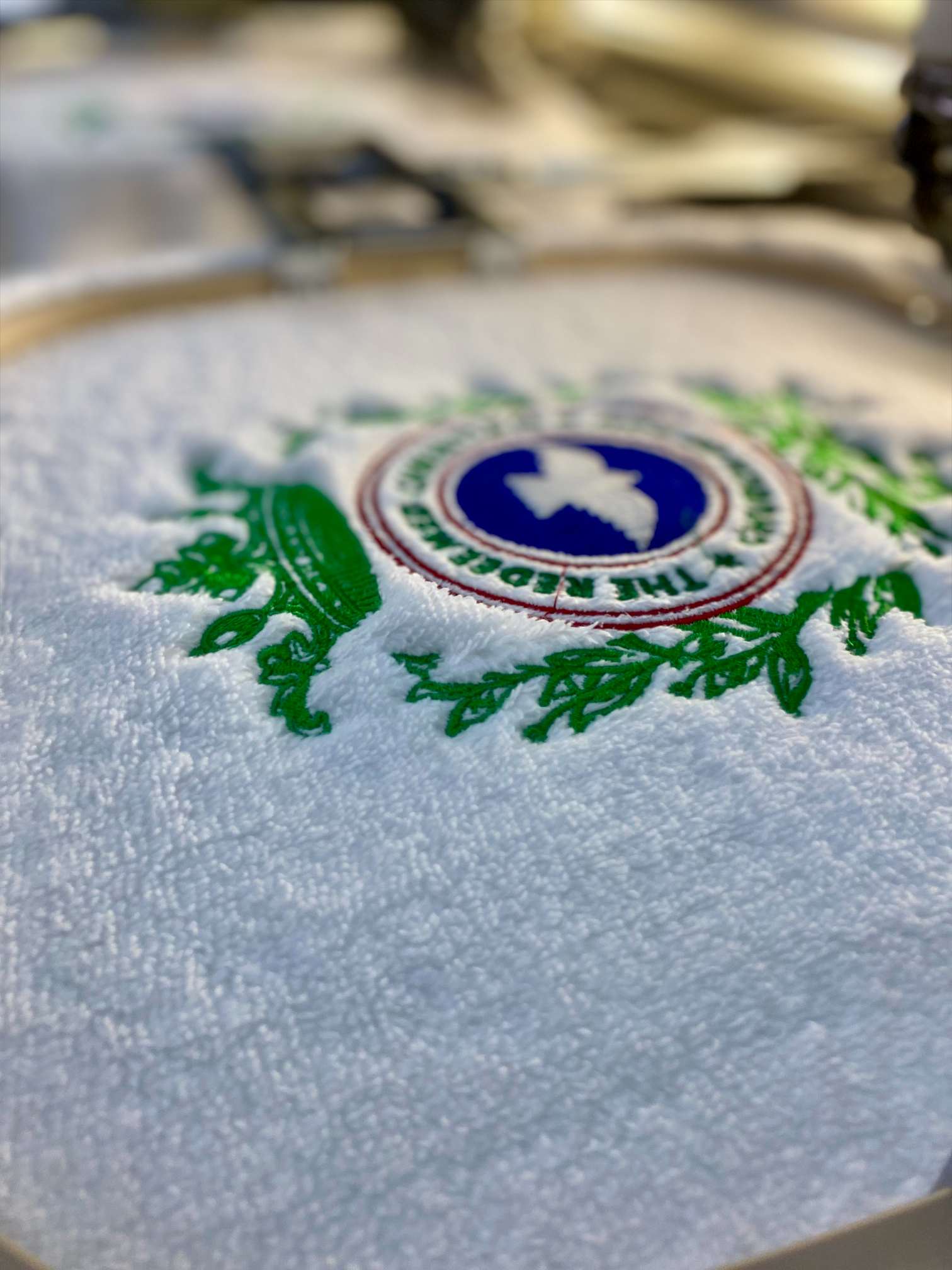 Close-up detail of machine embroidery being stitched